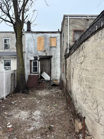 a couple of chairs sitting in patio of a house