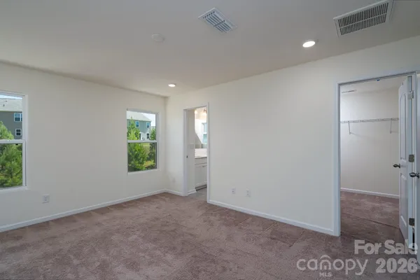 a bathroom with a shower and a glass door