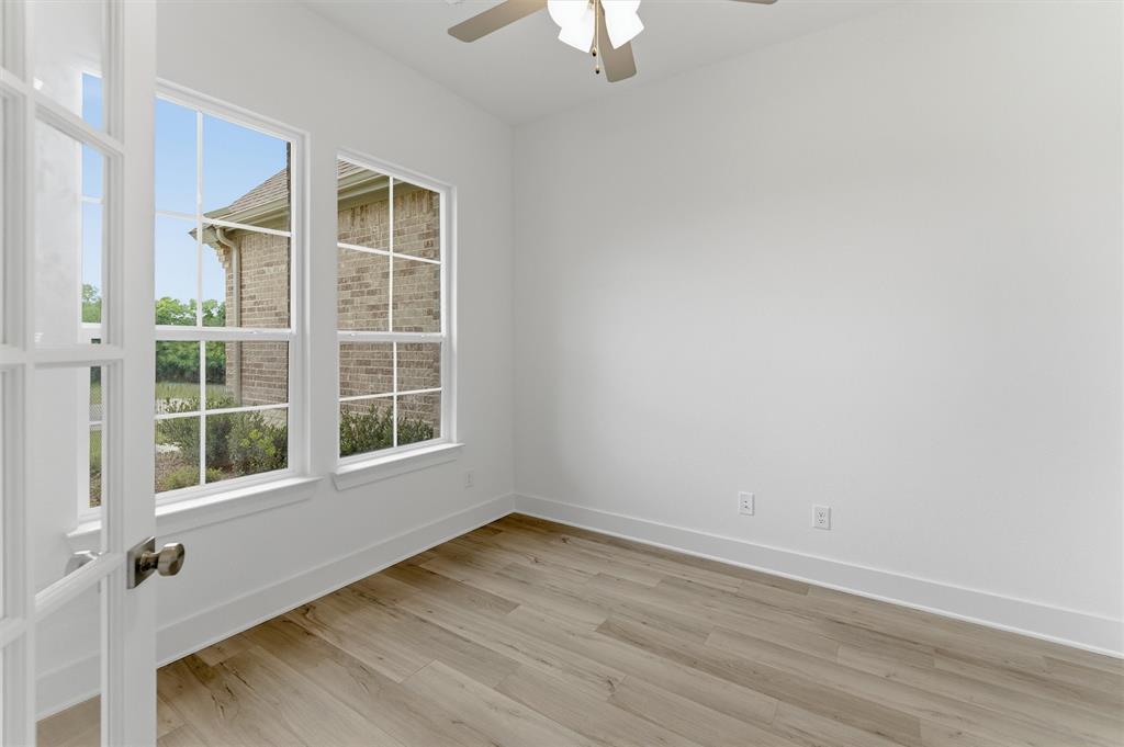 906 Perrin Lane Van Alstyne, TX 75495 - Photo 6 of 30 an empty room with a window