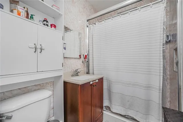 a kitchen with stainless steel appliances granite countertop a refrigerator and a stove