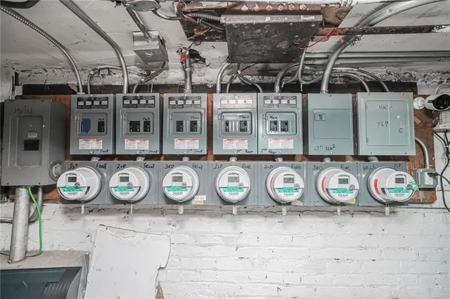 a room with water heater and wooden walls