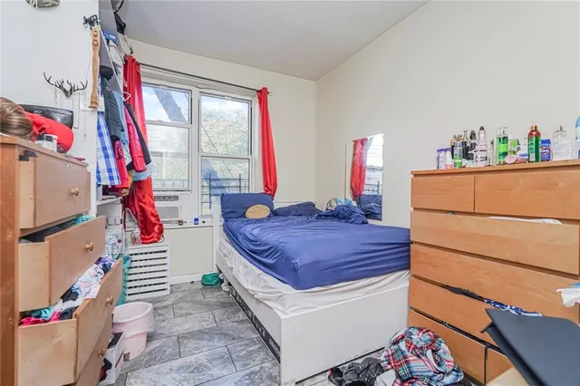 a room with a bed and a window