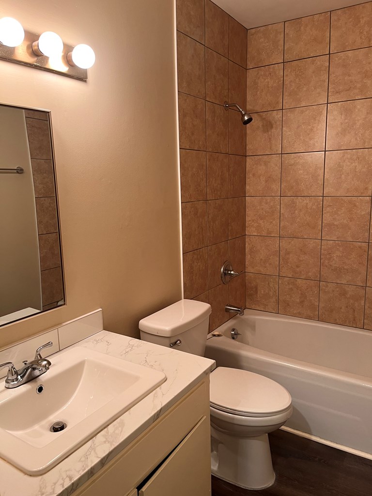 2312 15th Street, Unit A Columbus, GA 31906 - Photo 15 of 20 a bathroom with a toilet a sink and bathtub