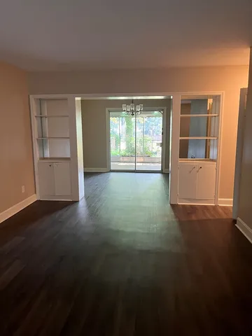 a view of empty room with windows