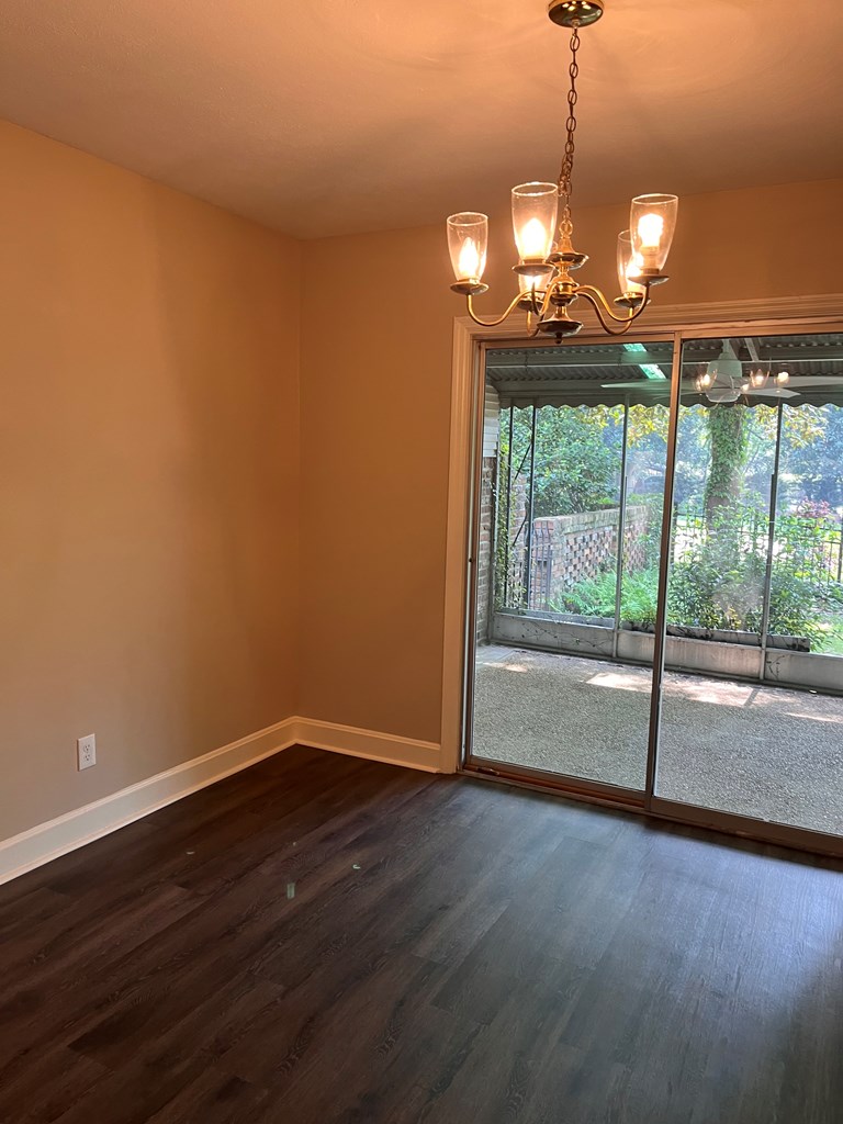 2312 15th Street, Unit A Columbus, GA 31906 - Photo 8 of 20 a view of empty room with wooden floor and fan