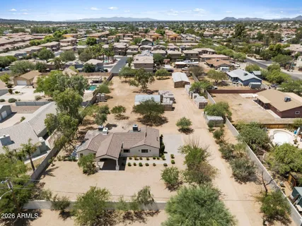 an aerial view of residential houses with outdoor space