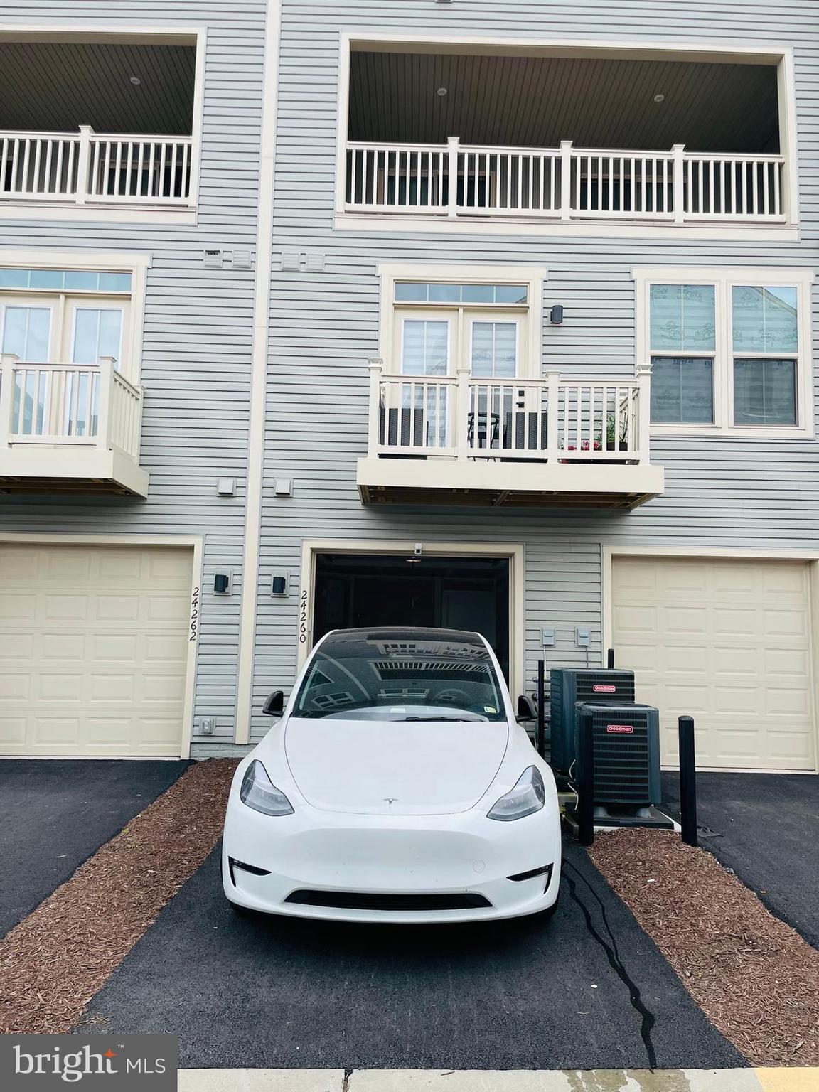 24260 Thurso Square Sterling, VA 20166 - Photo 15 of 16 a car parked in front of a building