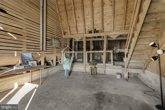 a view of an empty room with wooden roof
