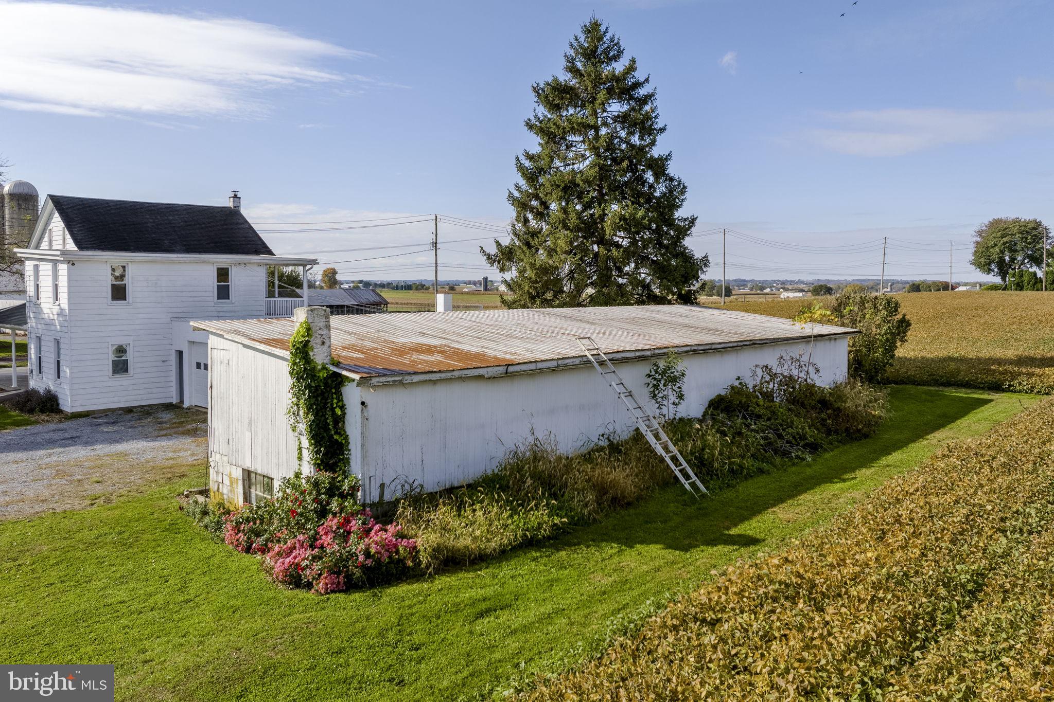 125 Indiantown Road Ephrata, PA 17522 - Photo 42 of 46 a view of a house with a garden and plants