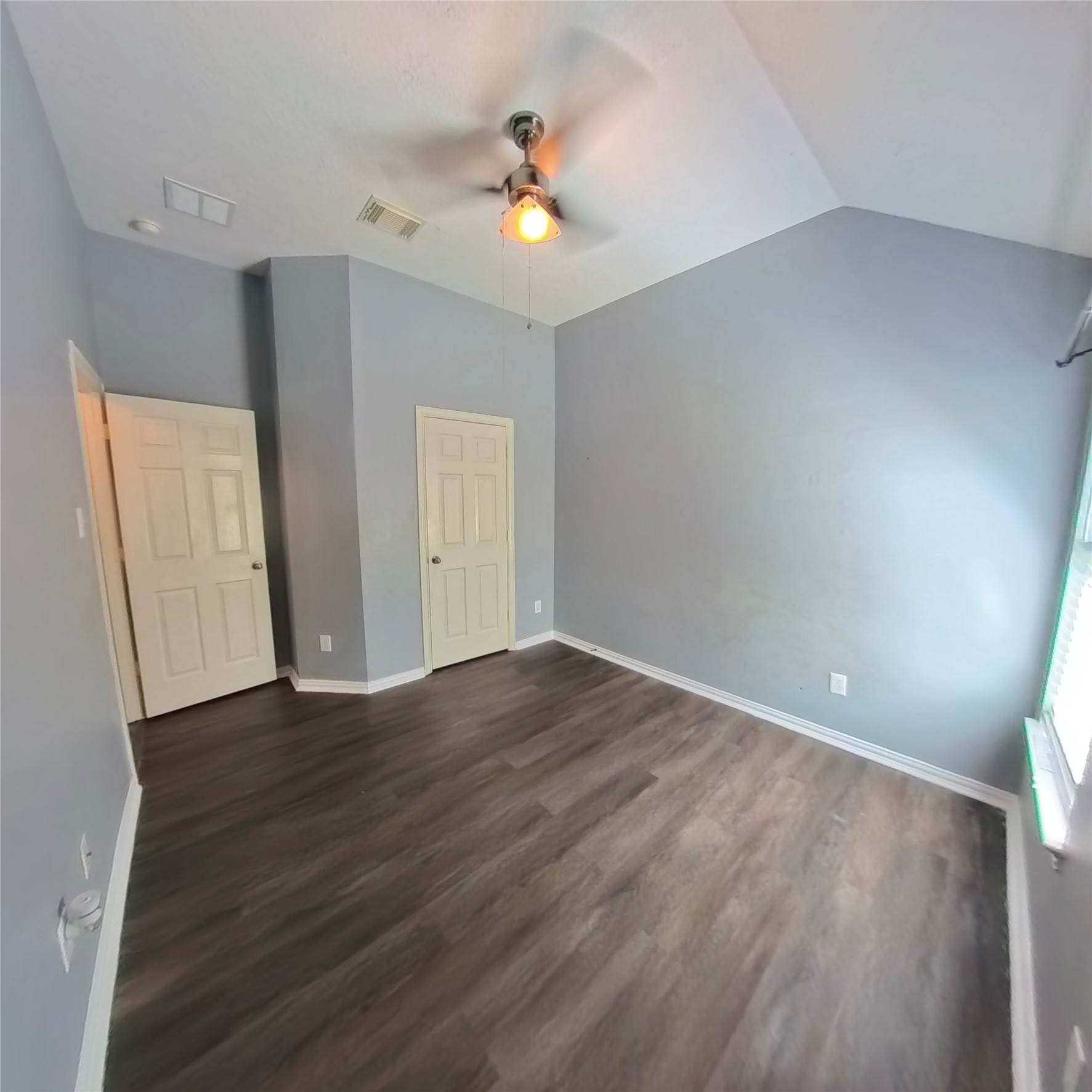 30938 Blue Ridge Park Lane Spring, TX 77386 - Photo 11 of 32 wooden floor in an empty room with a window