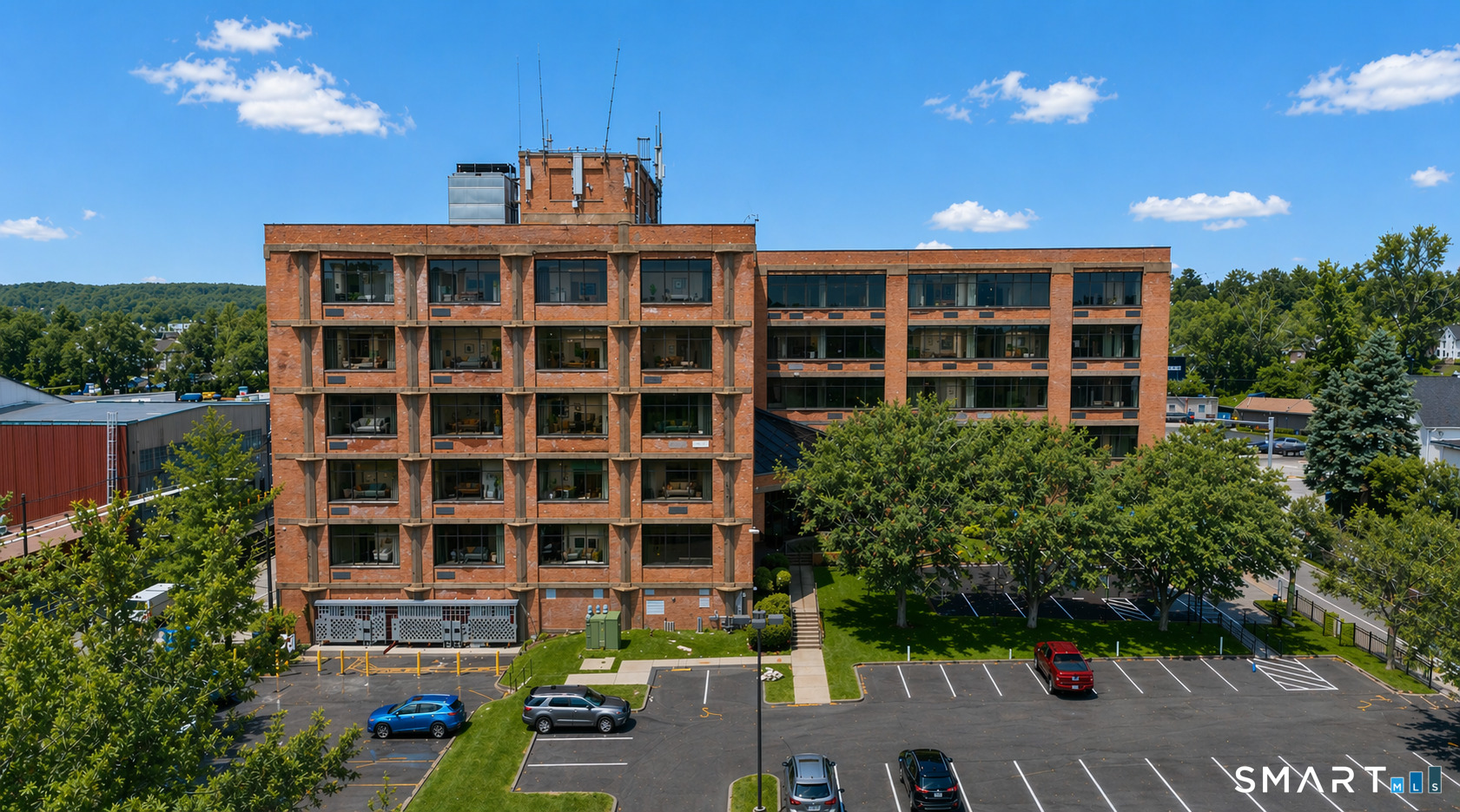480 Myrtle Street, Unit 402 New Britain, CT 06053 - Photo 17 of 17 a front view of a building with garden