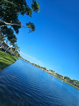a view of a lake with houses in the back