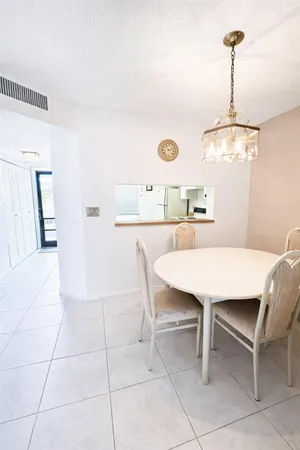 a dining room with a table and chairs