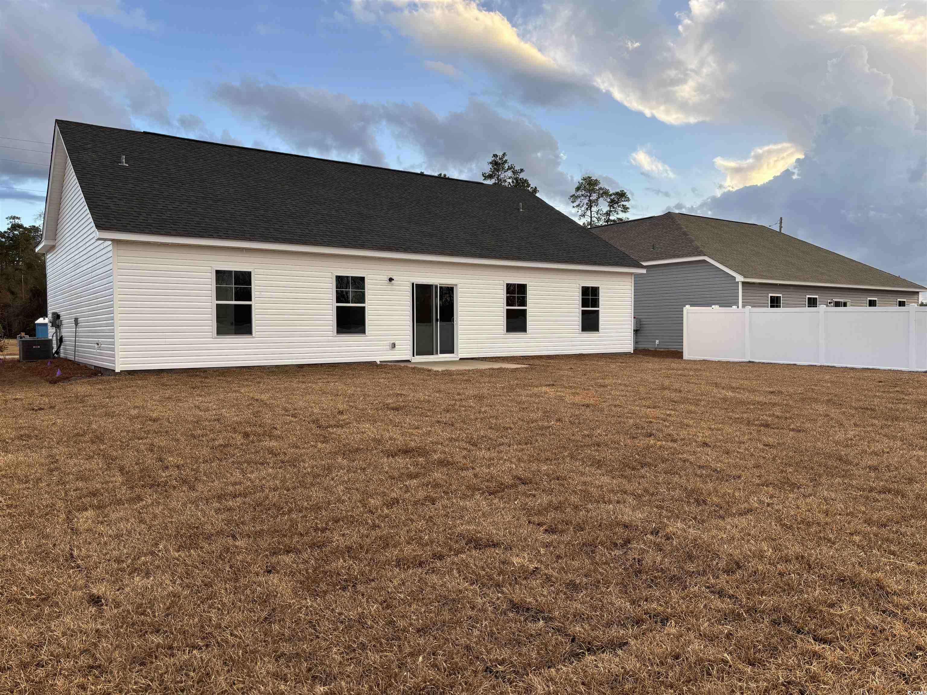 436 Hallie Martin Road Conway, SC 29527 - Photo 4 of 32 Back of house with a yard and central AC unit