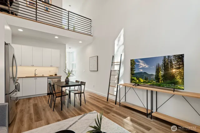 a view of a dining room with furniture window and wooden floor
