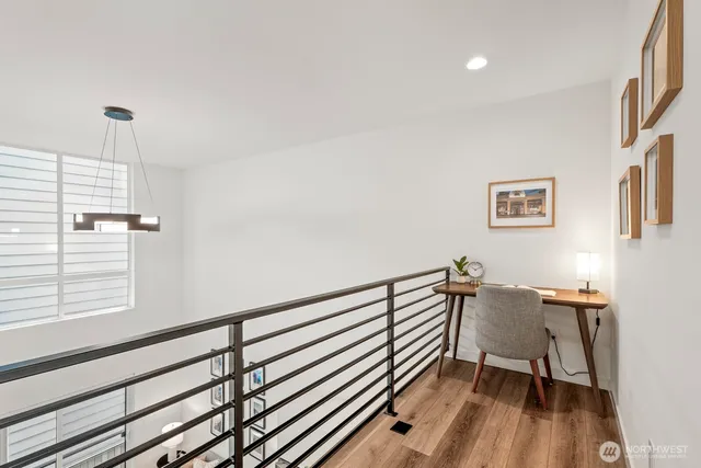 a view of a room with furniture wooden floor and window