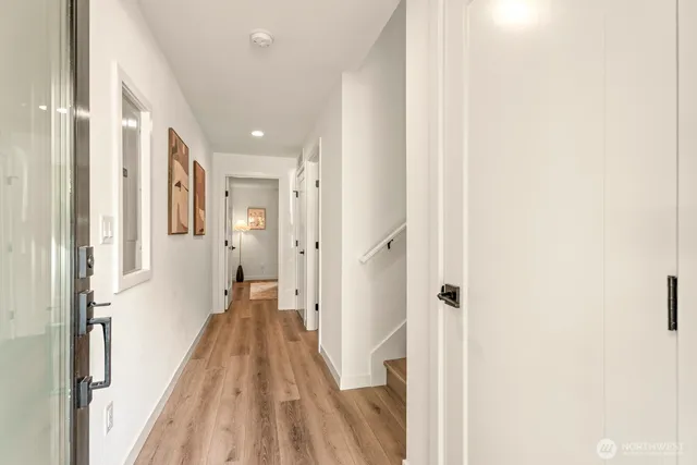 a view of a hallway with a white walls