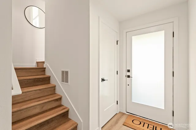 a view of a hallway with staircase