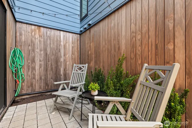 a view of outdoor space with a table and chairs