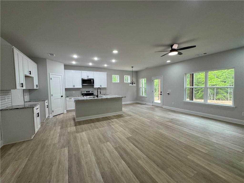 2057 North Hicks Road Toccoa, GA 30577 - Photo 10 of 22 a view of kitchen with wooden floor and window