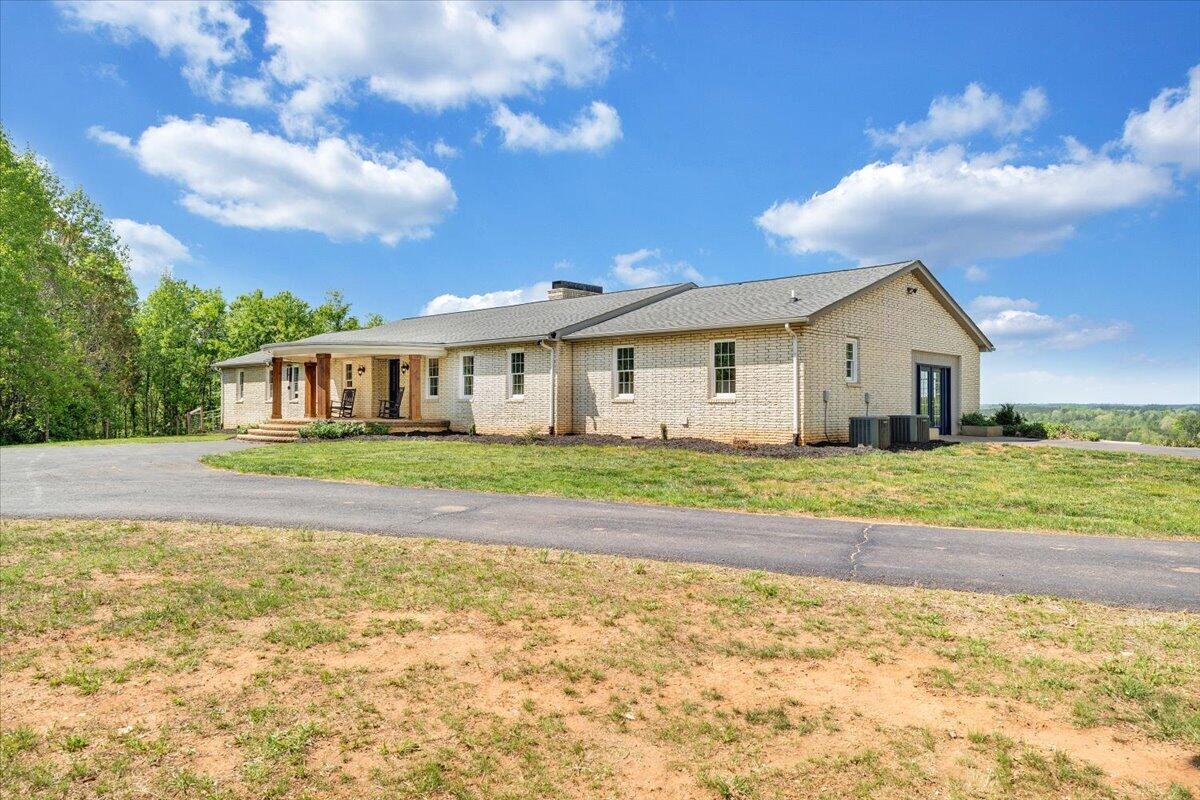 2011 Spencer-Preston Road Martinsville, VA 24112 - Photo 120 of 130 a view of a house with a big yard and large trees