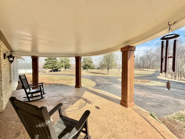 a kitchen with stainless steel appliances granite countertop a stove a sink dishwasher and a refrigerator with wooden floor