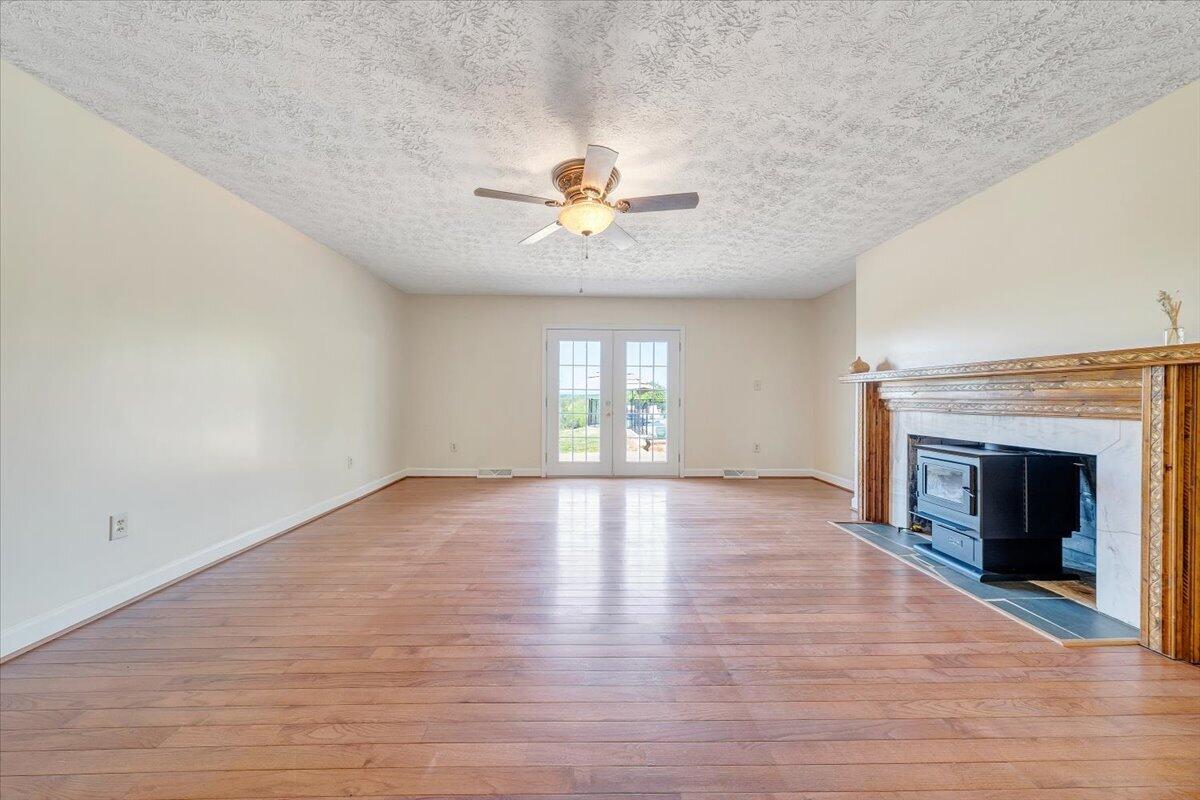 2011 Spencer-Preston Road Martinsville, VA 24112 - Photo 13 of 130 a view of an empty room with window and wooden floor