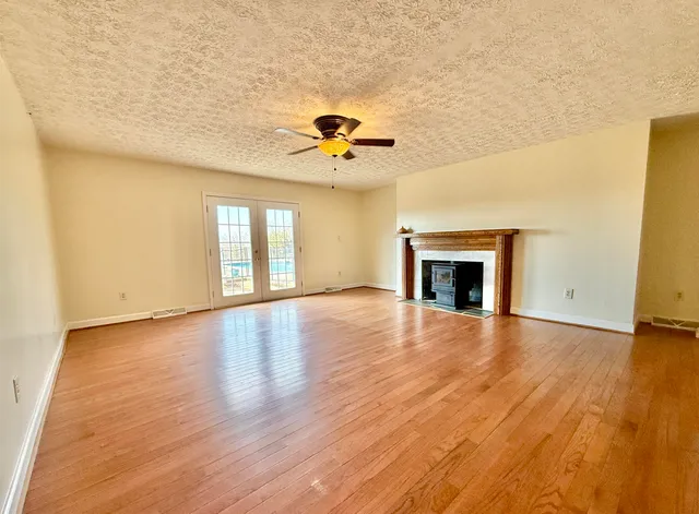 a view of a house with a snow on the road