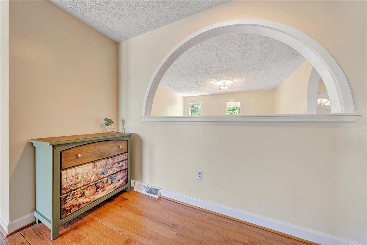 2011 Spencer-Preston Road Martinsville, VA 24112 - Photo 49 of 130 a view of an empty room with wooden floor and a window