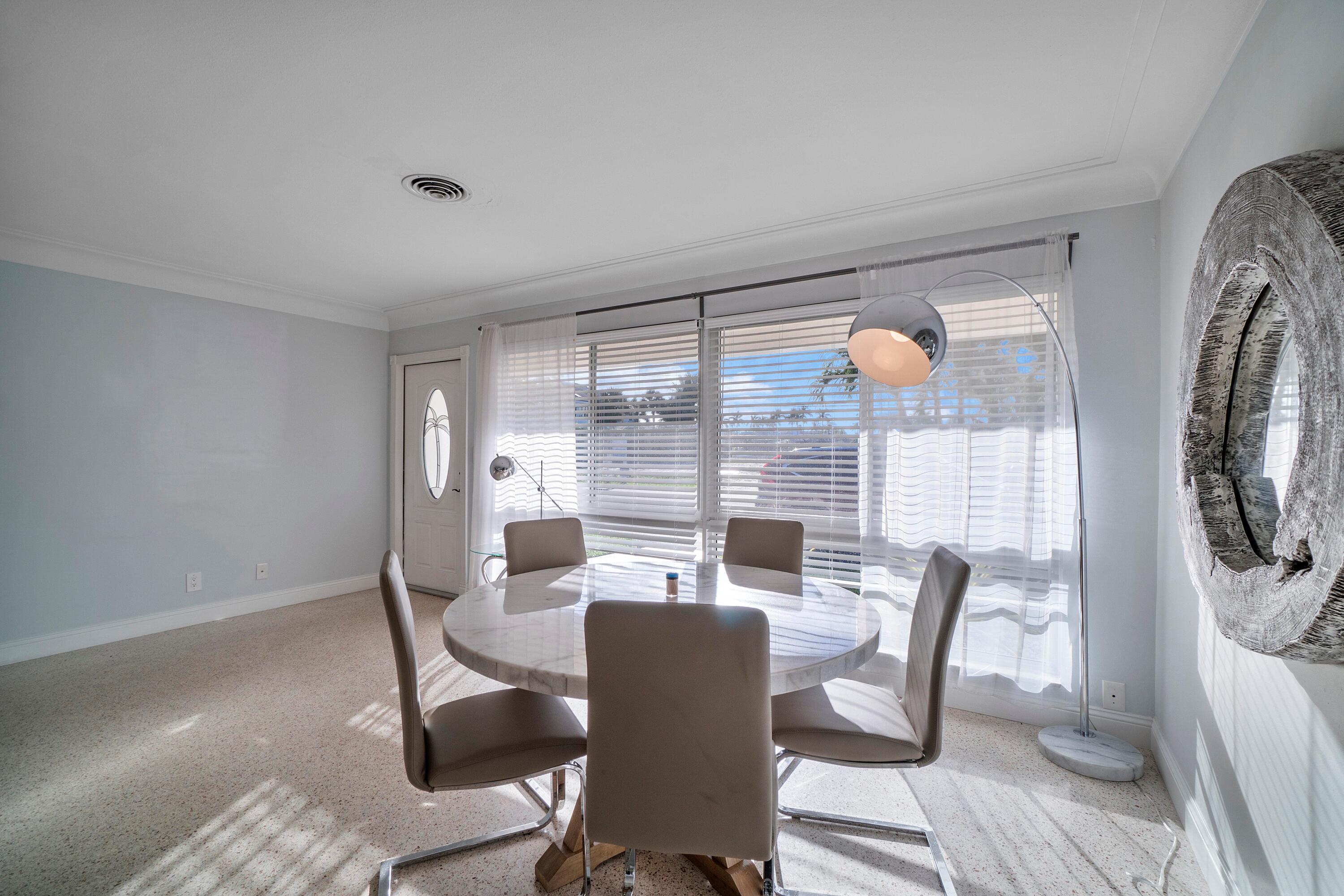2900 Spanish River Road Boca Raton, FL 33432 - Photo 12 of 25 a view of a dining room with furniture window and outside view
