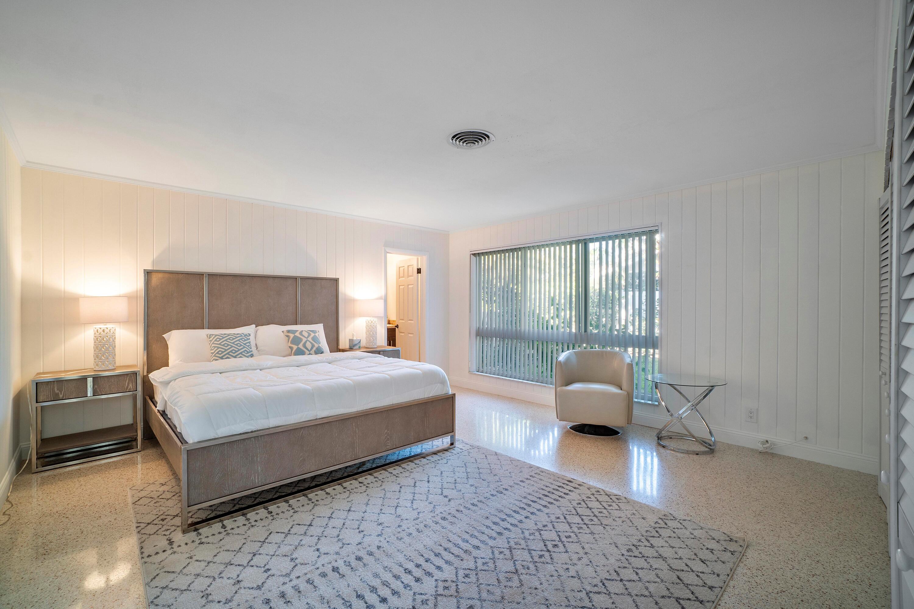 2900 Spanish River Road Boca Raton, FL 33432 - Photo 17 of 25 a bedroom with a bed rug and a couch