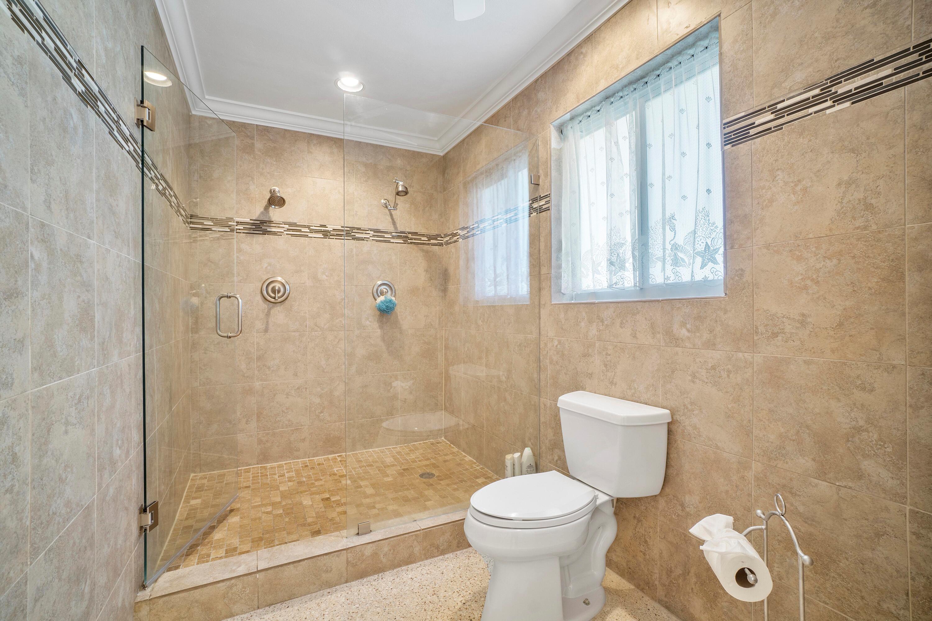 2900 Spanish River Road Boca Raton, FL 33432 - Photo 19 of 25 a bathroom with a toilet and a shower