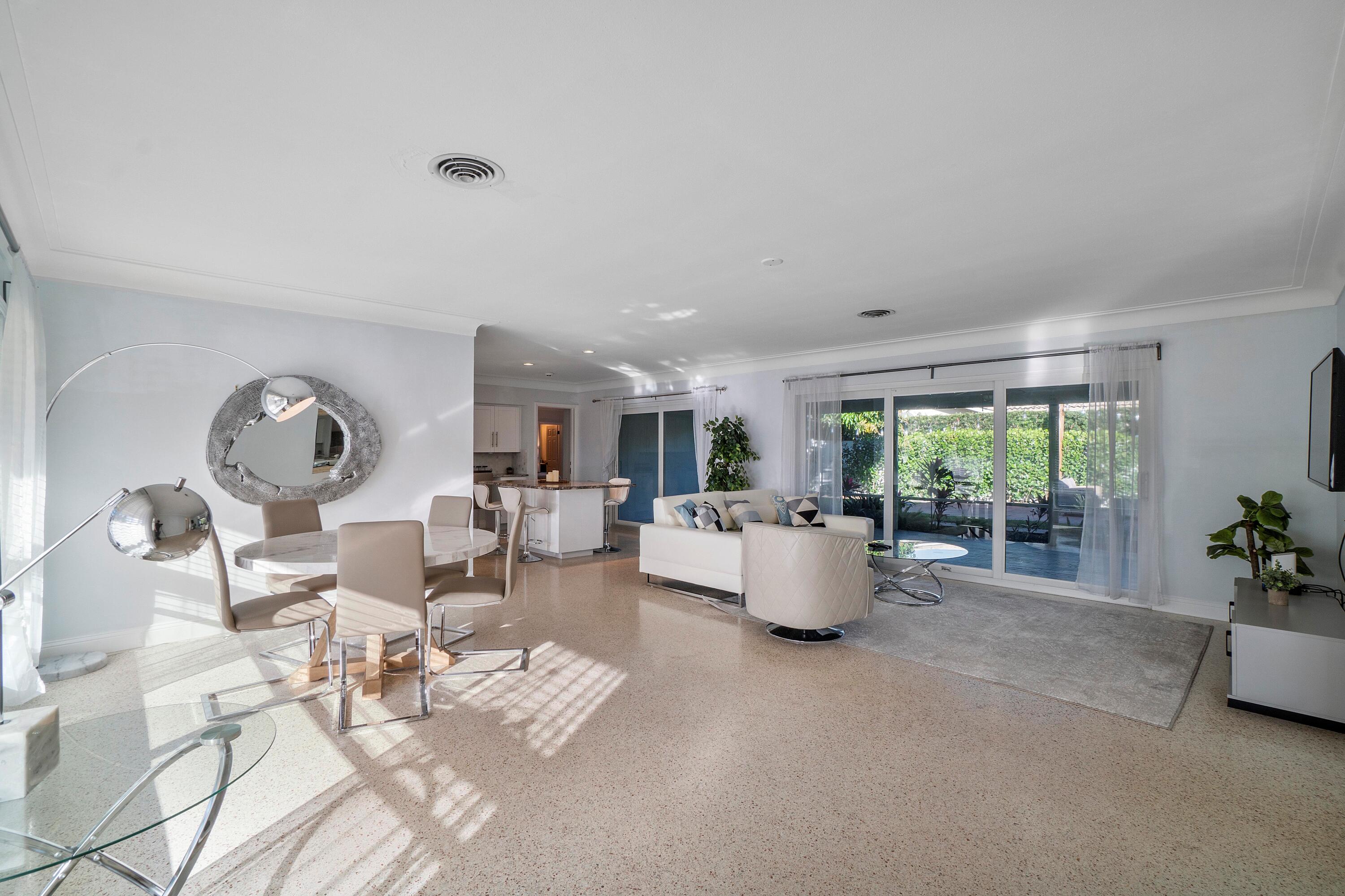 2900 Spanish River Road Boca Raton, FL 33432 - Photo 9 of 25 a living room with furniture and a large window