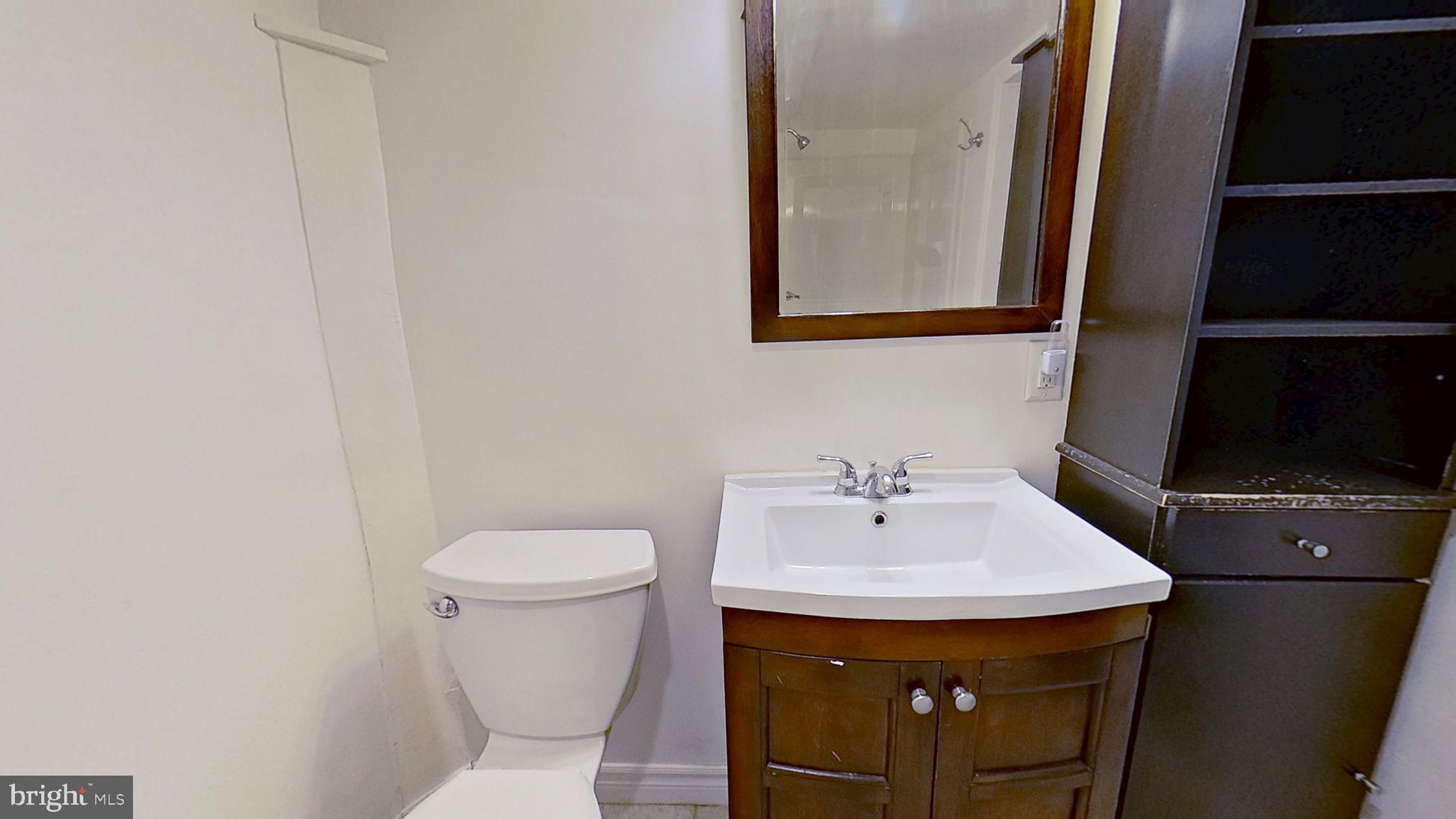 28 East Maple Street Dallastown, PA 17313 - Photo 4 of 6 a bathroom with a sink and a toilet