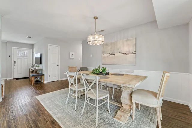 a view of a dining room with furniture window and wooden floor