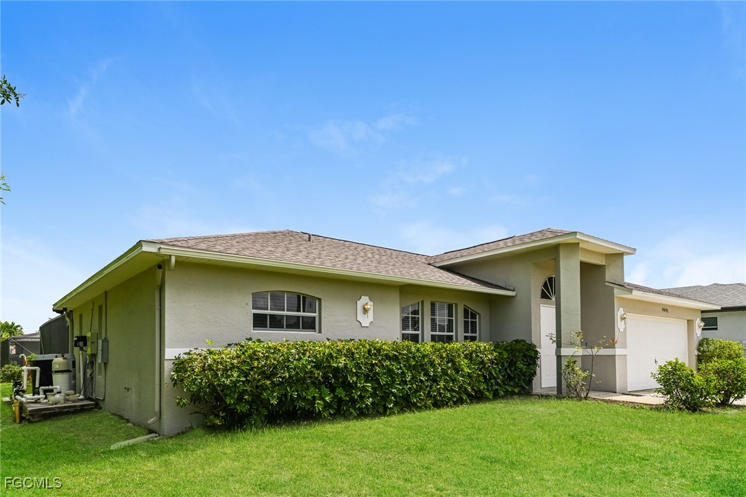 9091 Morris Road Fort Myers, FL 33967 - Photo 2 of 15 a view of a house with backyard