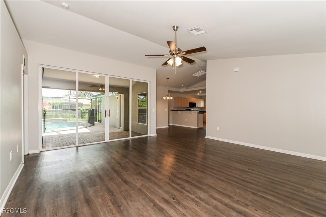 9091 Morris Road Fort Myers, FL 33967 - Photo 4 of 15 a view of empty room with wooden floor and fan