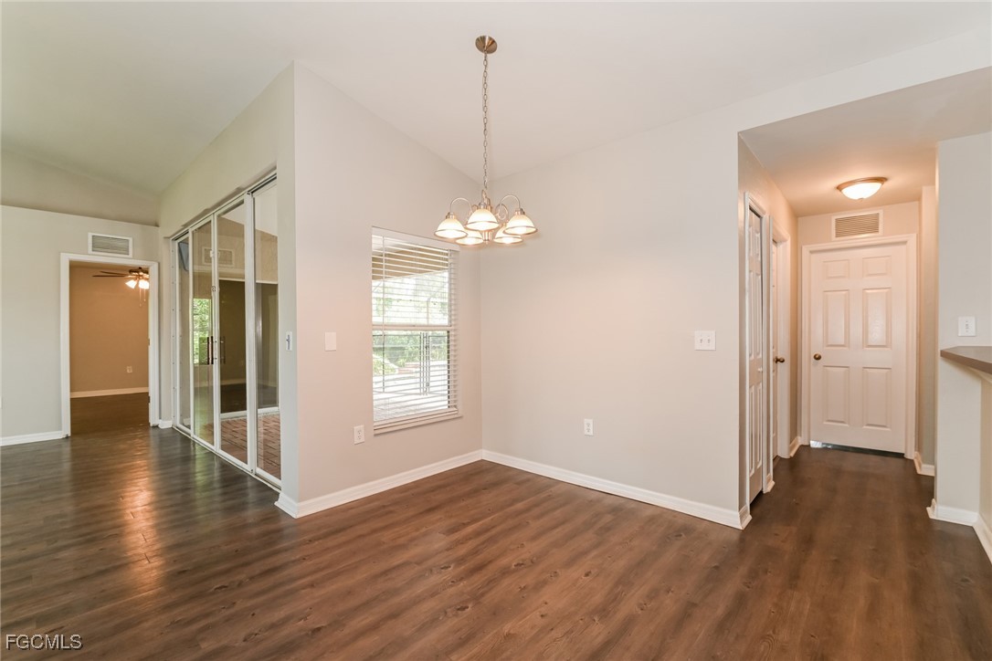 9091 Morris Road Fort Myers, FL 33967 - Photo 5 of 15 a view of a room with wooden floor and window