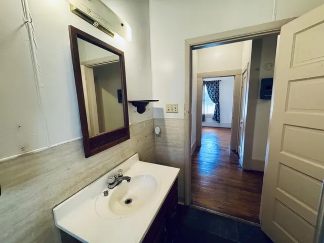 a bathroom with a sink and mirror