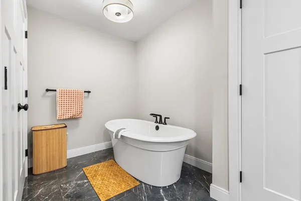 a white toilet sitting next to a bathroom sink