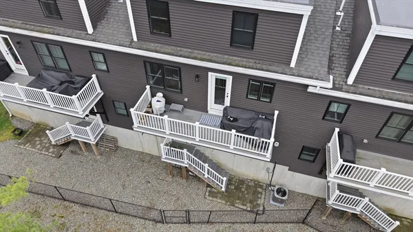 a front view of a building with a deck