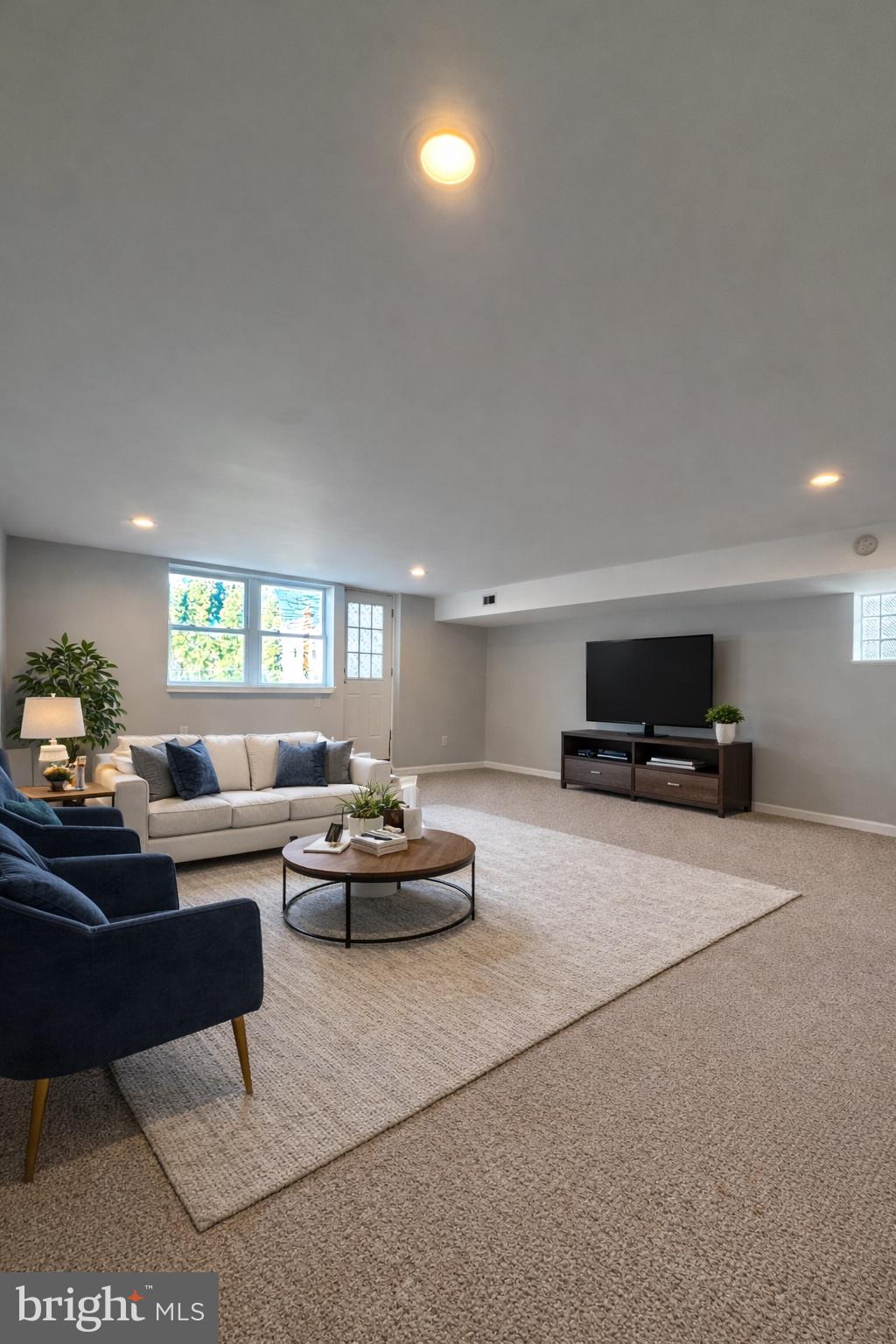 419 Rennard Street Philadelphia, PA 19116 - Photo 13 of 15 a living room with furniture and a flat screen tv