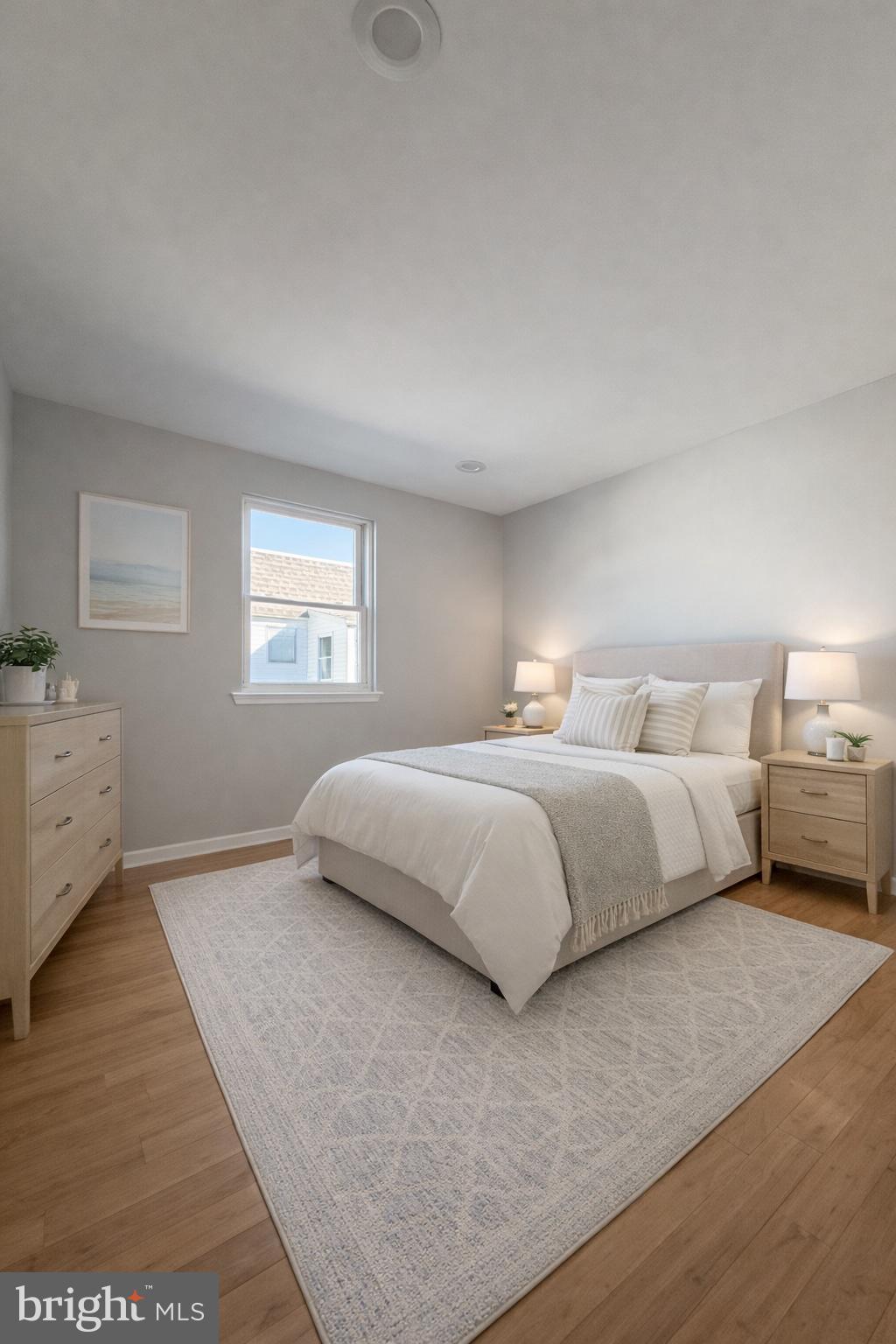 419 Rennard Street Philadelphia, PA 19116 - Photo 6 of 15 a bedroom with a bed and window