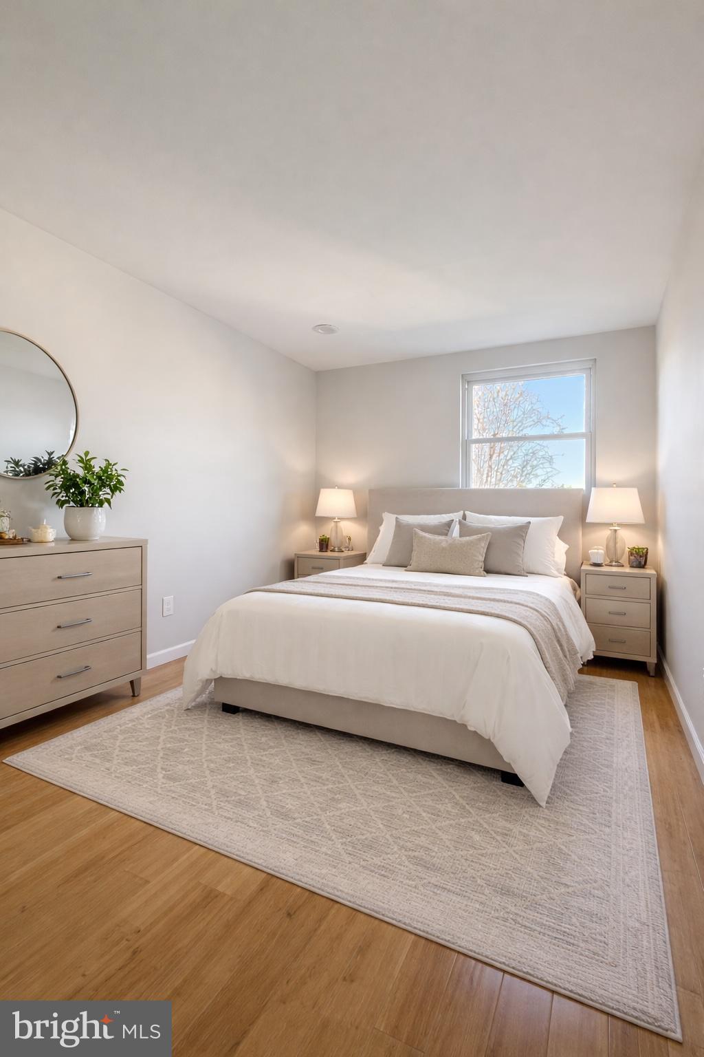 419 Rennard Street Philadelphia, PA 19116 - Photo 8 of 15 a bedroom with a bed and a potted plant
