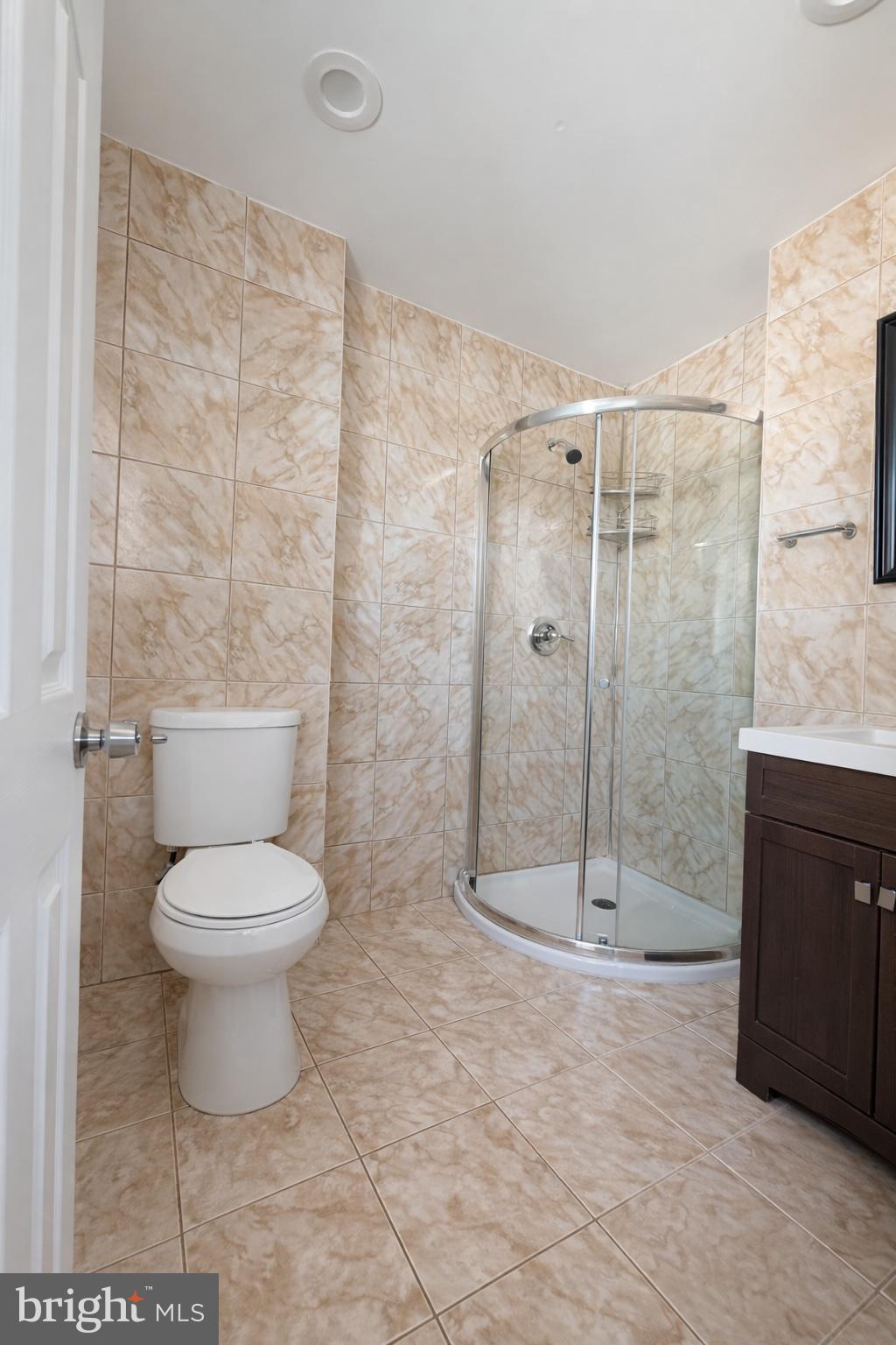 419 Rennard Street Philadelphia, PA 19116 - Photo 9 of 15 a bathroom with a toilet and a shower