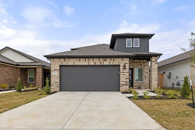 a front view of a house with yard