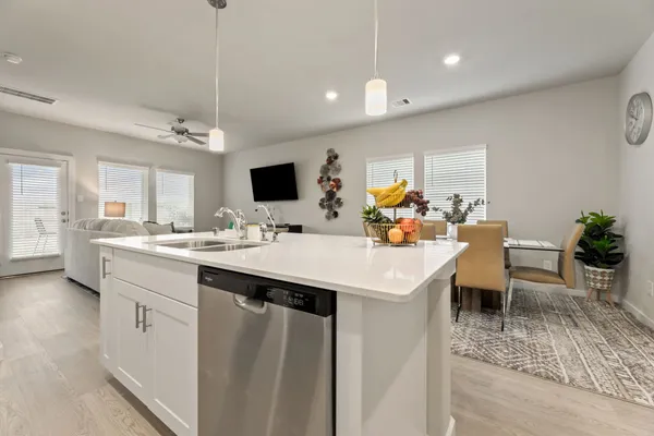 a view of a kitchen area kitchen island dining table and chairs