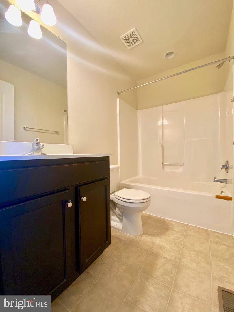 1100 Frontline Drive Frederick, MD 21703 - Photo 11 of 19 a bathroom with a sink a toilet and a bathtub