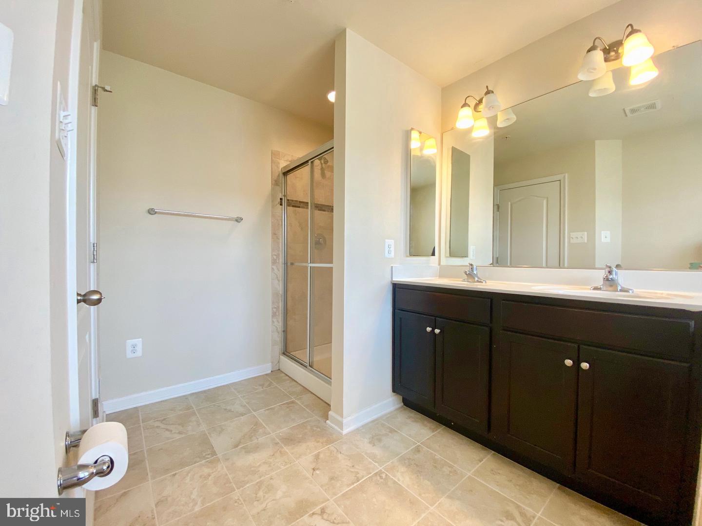1100 Frontline Drive Frederick, MD 21703 - Photo 14 of 19 a bathroom with a double vanity sink mirror and double