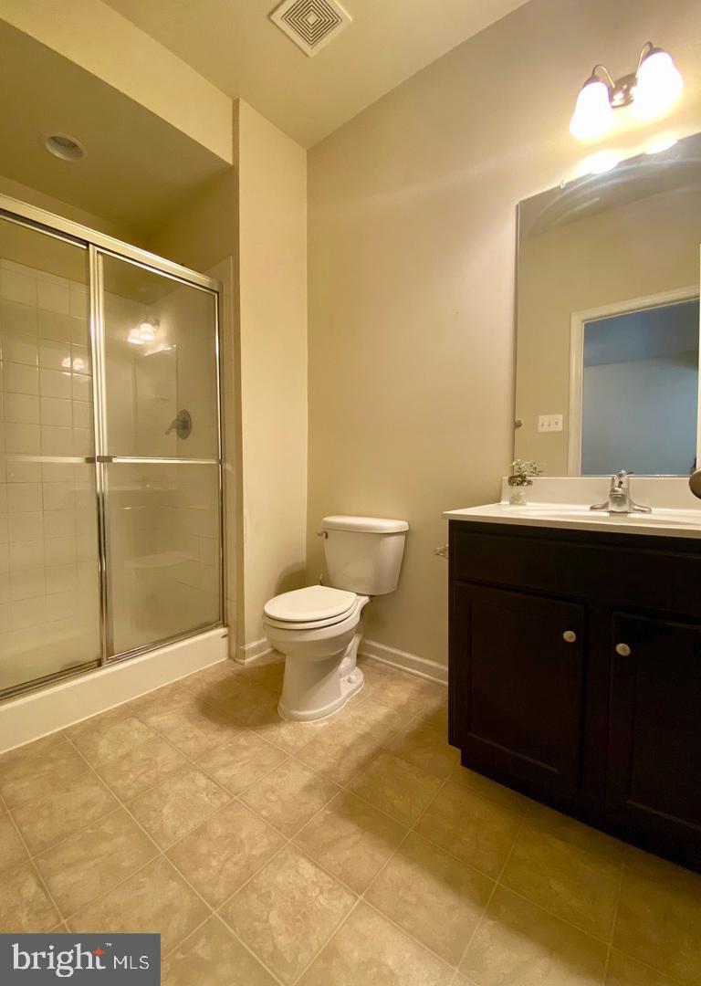 1100 Frontline Drive Frederick, MD 21703 - Photo 16 of 19 a bathroom with a sink and a mirror